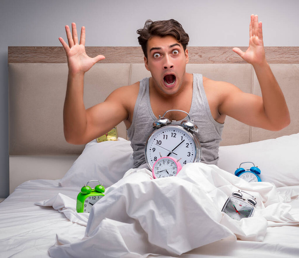 Man having trouble waking up in the morning - Photo, Image