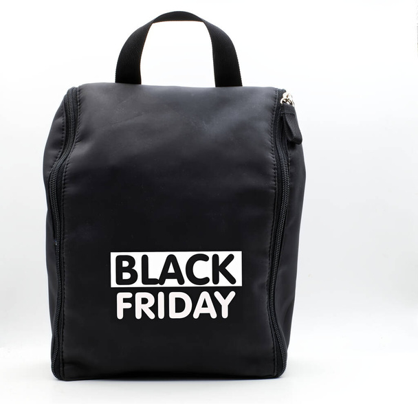 Black leather bag with Black Friday logotype. Black Friday concept - Φωτογραφία, εικόνα