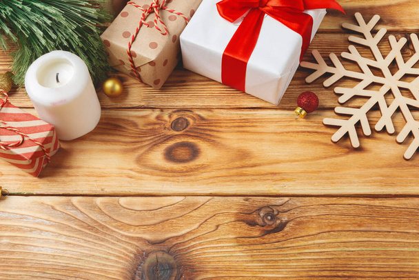 top view of wrapped christmas gift boxes on wooden background - Φωτογραφία, εικόνα