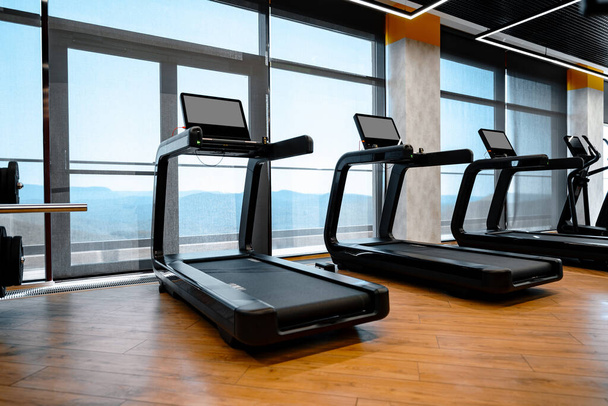 Studio shot of a professional treadmill in modern gym - Foto, Imagen