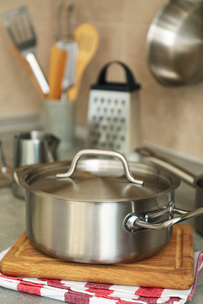 Concept of kitchen utensil with metal pot, selective focus. - Photo, Image