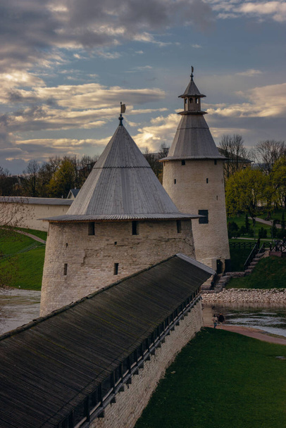Kremlin in Pskov, Russia. Ancient fortress. Stone towers on a summer day. Places for tourists and travel. An ancient Russian city. Postcard viewing. Tourist routes and attractions - 写真・画像