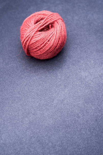 multicolor decoration yarns on a dark stone background with copy space - Foto, afbeelding