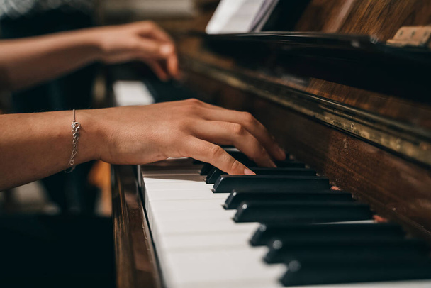 A female's hands playing the piano - Photo, Image