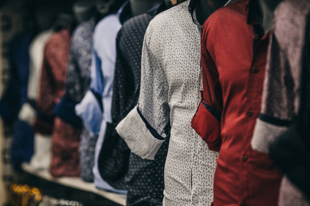 A selective focus shot of different shirts for men on display in a shop - 写真・画像