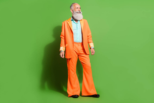 Full length body size view of attractive cheerful man wearing festal look copy space isolated over bright green color background - Foto, Imagem