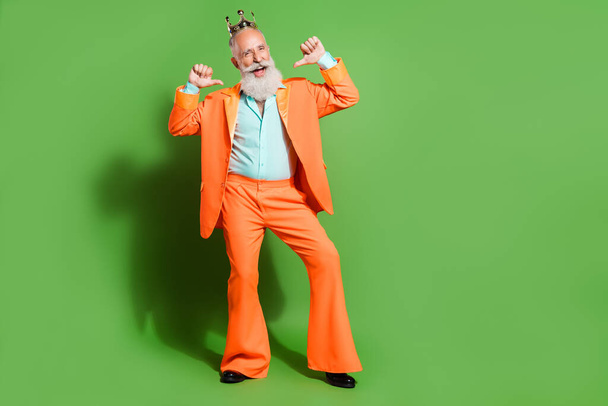 Full length body size view of attractive cheerful cool man presenting himself isolated over bright green color background - Φωτογραφία, εικόνα