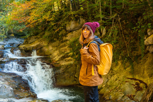 Irati forest or jungle in autumn, a young hiker in the Cubos waterfall. Ochagavia, northern Navarra in Spain - Foto, Imagem