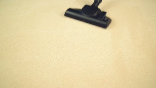 Vacuum Cleaner sweeping Brand New Carpet. Housework and home hygiene - Кадри, відео