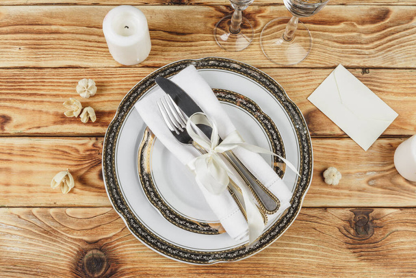 Beautiful table setting on wooden table from above - Zdjęcie, obraz