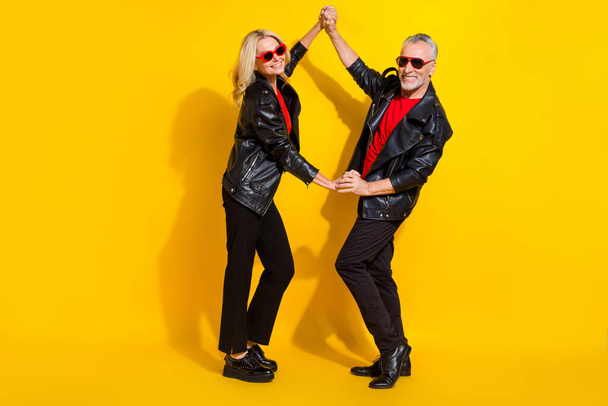 Full length body size view of beautiful handsome pensioner grey-haired lovers dancing rest isolated over vivid yellow color background - Photo, Image