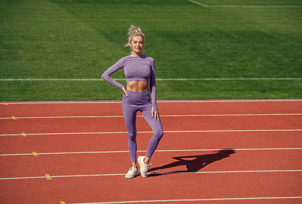 athletic woman in fitness wear on stadium, sport - Photo, image