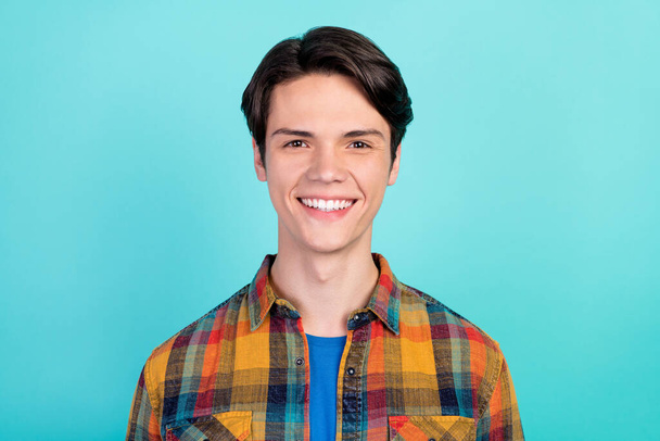 Photo of cheerful positive charming guy toothy shiny smile wear plaid shirt isolated aquamarine color background - Foto, imagen