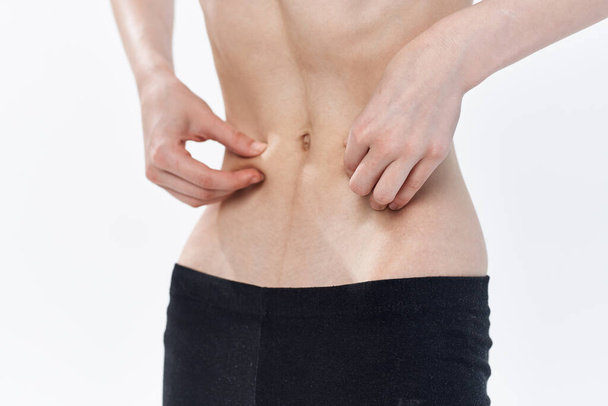 女性の腹リトラクション痩身ダイエット拒食症 - 写真・画像