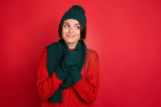 Photo of young woman happy positive smile dream look empty space holiday isolated over red color background - 写真・画像