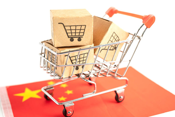 Box with shopping cart logo and China flag, Import Export Shopping online or eCommerce finance delivery service store product shipping, trade, supplier concept. - 写真・画像