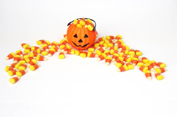 mini jack-o-lantern with Halloween candy corn with copy space - Photo, Image