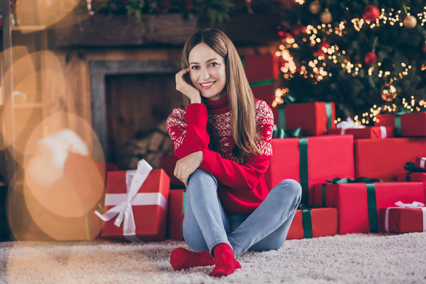 Photo of sweet thoughtful mature lady wear red pullover smiling hand cheek arm cheekbone enjoying christmas indoors house home room - Photo, image