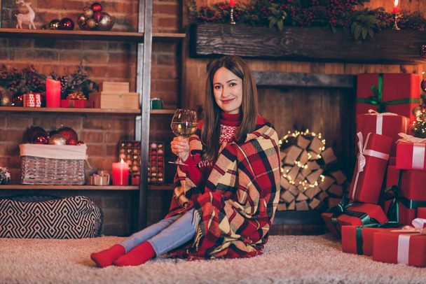 Photo of adorable pretty mature lady wear red pullover smiling drinking wine enjoying christmas indoors house home room - Valokuva, kuva