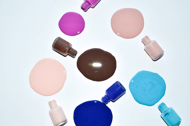 Shot of Nail polish enamel mixed multicolor samples, isolated on white background - Zdjęcie, obraz