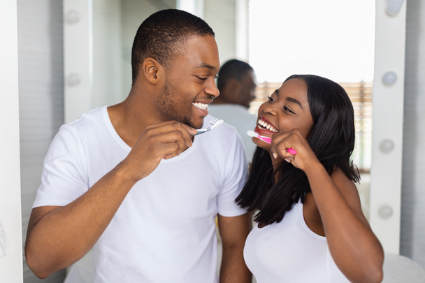 Romantic Black Couple Brushing Teeth And Smiling To Each Other In Bathroom - Photo, Image