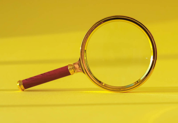 Magnifying glass on yellow background with light and shadow - Zdjęcie, obraz