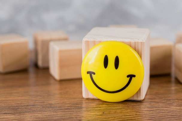 front view smiley face wooden block. High quality photo - Fotoğraf, Görsel