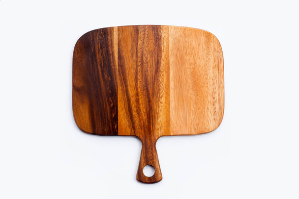 Wooden cutting board on white background. - 写真・画像