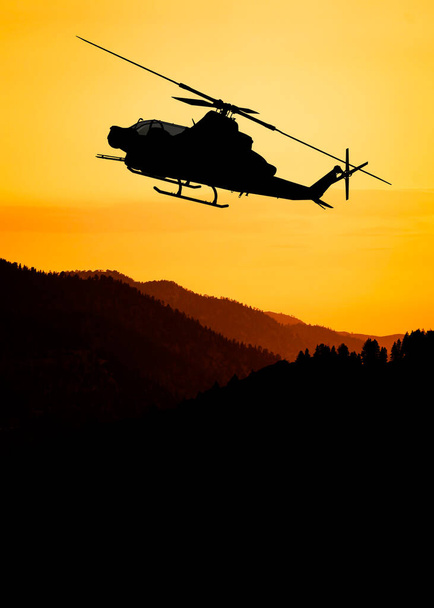 Силуэт американского ударного вертолета в полете - Фото, изображение