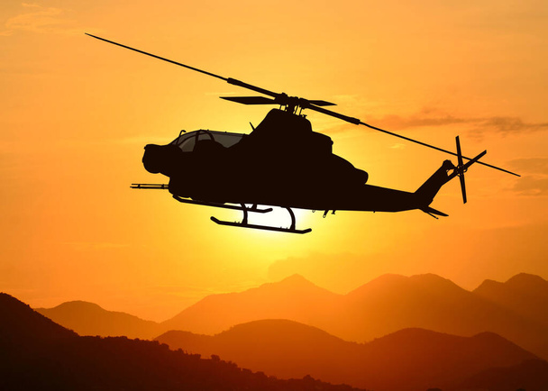 Силуэт американского ударного вертолета в полете - Фото, изображение
