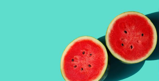 Watermelon on blue background with copy space. Summer background concept. - Fotografie, Obrázek