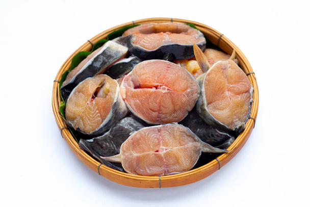 Catfish cut pieces in bamboo basket on white background. - Photo, Image