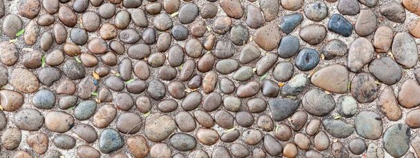 Panorama of Brown pebbles floor pattern and background seamless - Photo, Image