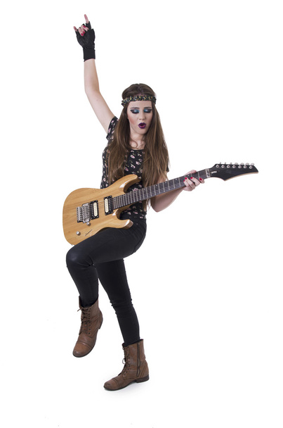 Young pretty blond rocker girl playing electric guitar - Fotó, kép