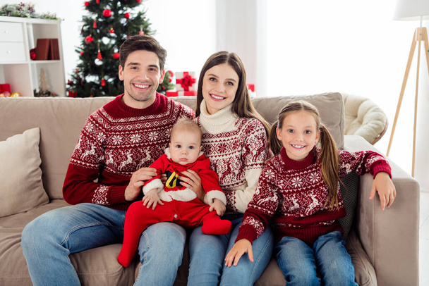 Photo of happy wife husband children sit couch family picture xmas smile indoors inside apartment house living room - Zdjęcie, obraz