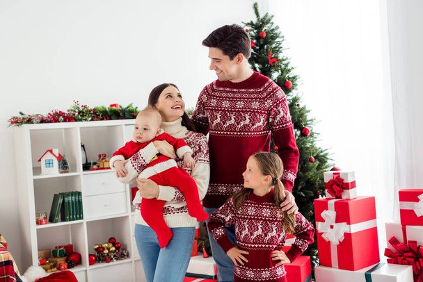 Photo of happy positive husband wife young family smile good mood enjoy holiday indoors in living room apartment - Photo, Image