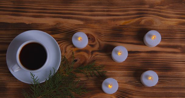 coffee and candles on wooden background - Fotografie, Obrázek