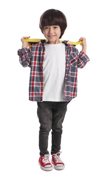 Cute little boy with skateboard on white background - Foto, Imagen