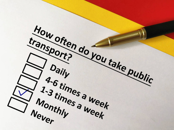 One person is answering question about transportation. The person takes public transport monthly. - Photo, Image
