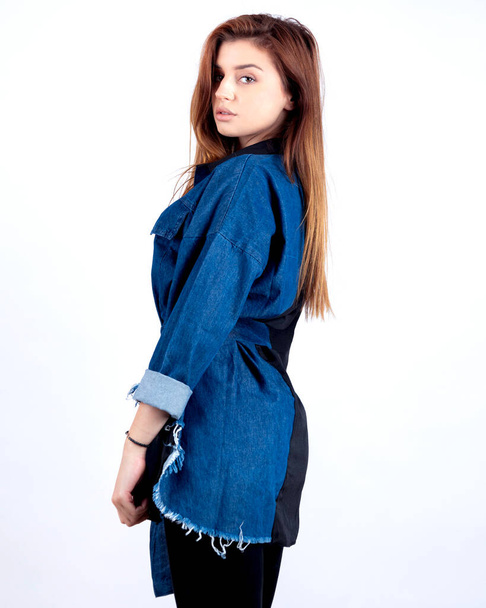 girl posing in studio with modern fashionable shirt  - Zdjęcie, obraz