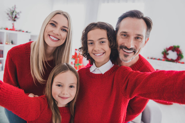 Self-portrait of careful beautiful handsome cheerful family mom dad schoolkids hugging spend eve advent at home house indoors - Photo, image