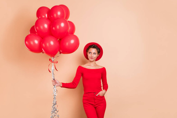 Photo of dreamy pretty nice woman look empty space red balloons season sale isolated on beige color background - Foto, Imagem