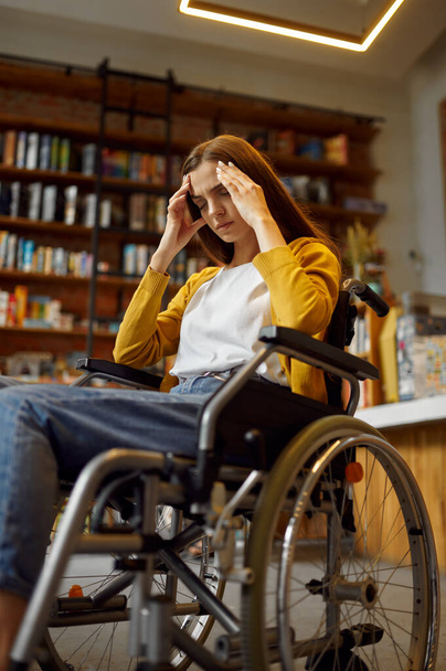 Stressed female student in wheelchair, disability - 写真・画像
