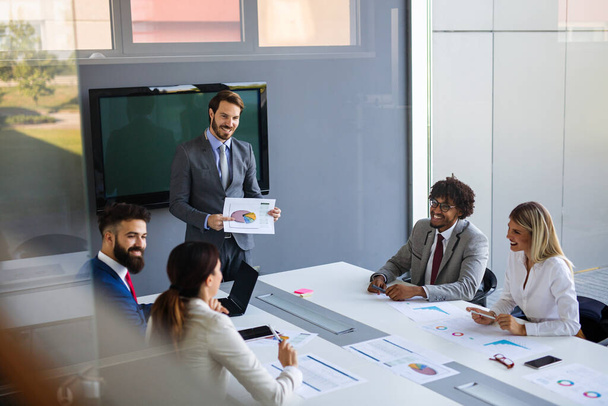 Group of diverse coworkers working together on business project in modern office - Photo, Image