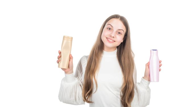 happy child presenting shampoo or hair body conditioner bottle isolated on white, advertisement - Φωτογραφία, εικόνα