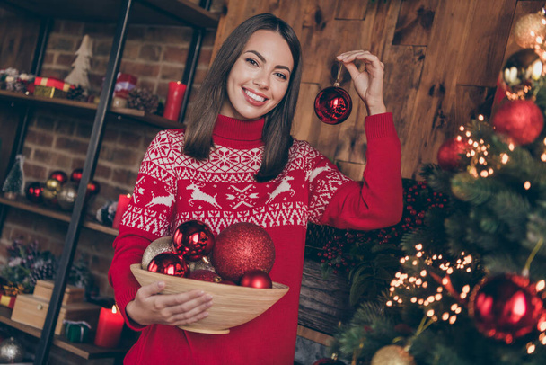 Photo of shiny attractive young lady wear red pullover smiling decorating christmas tree indoors house home room - Photo, image