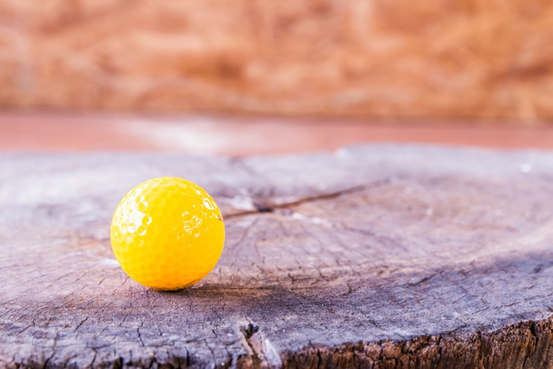 Yellow Miniature Golf Ball On White Background. - Фото, зображення