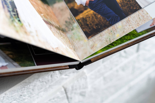photo book with wooden cover. unfolded photobook. sample photobook. - Foto, Imagem