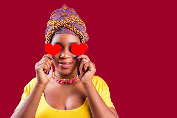 attractive lovely south woman with turban holding in hands heart isolated over red background valentines day february 14 - Foto, immagini
