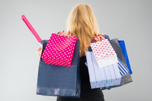 attractive blond woman with shopping bags - Foto, Imagem